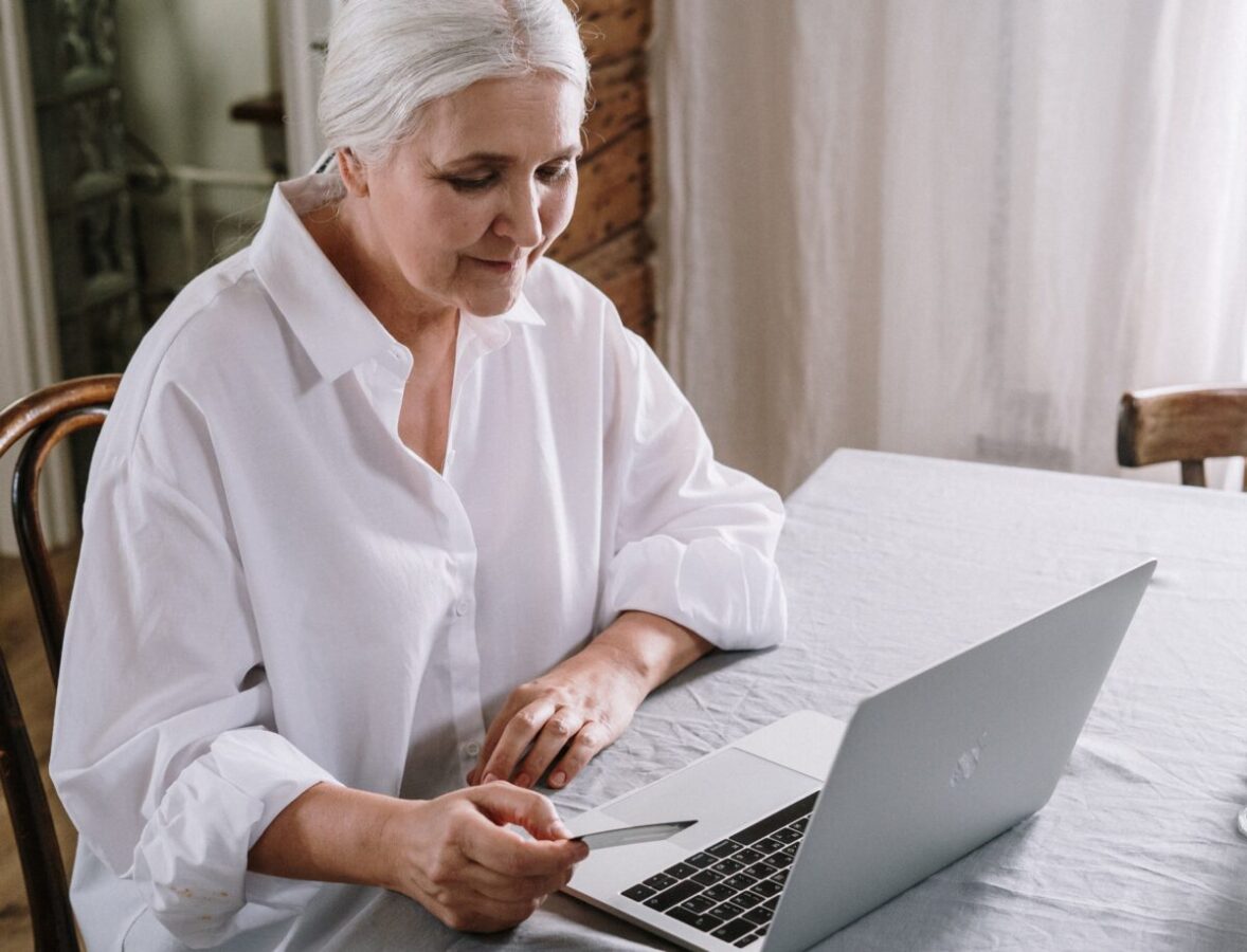 an-old-woman-using-a-laptop-4057758-scaled